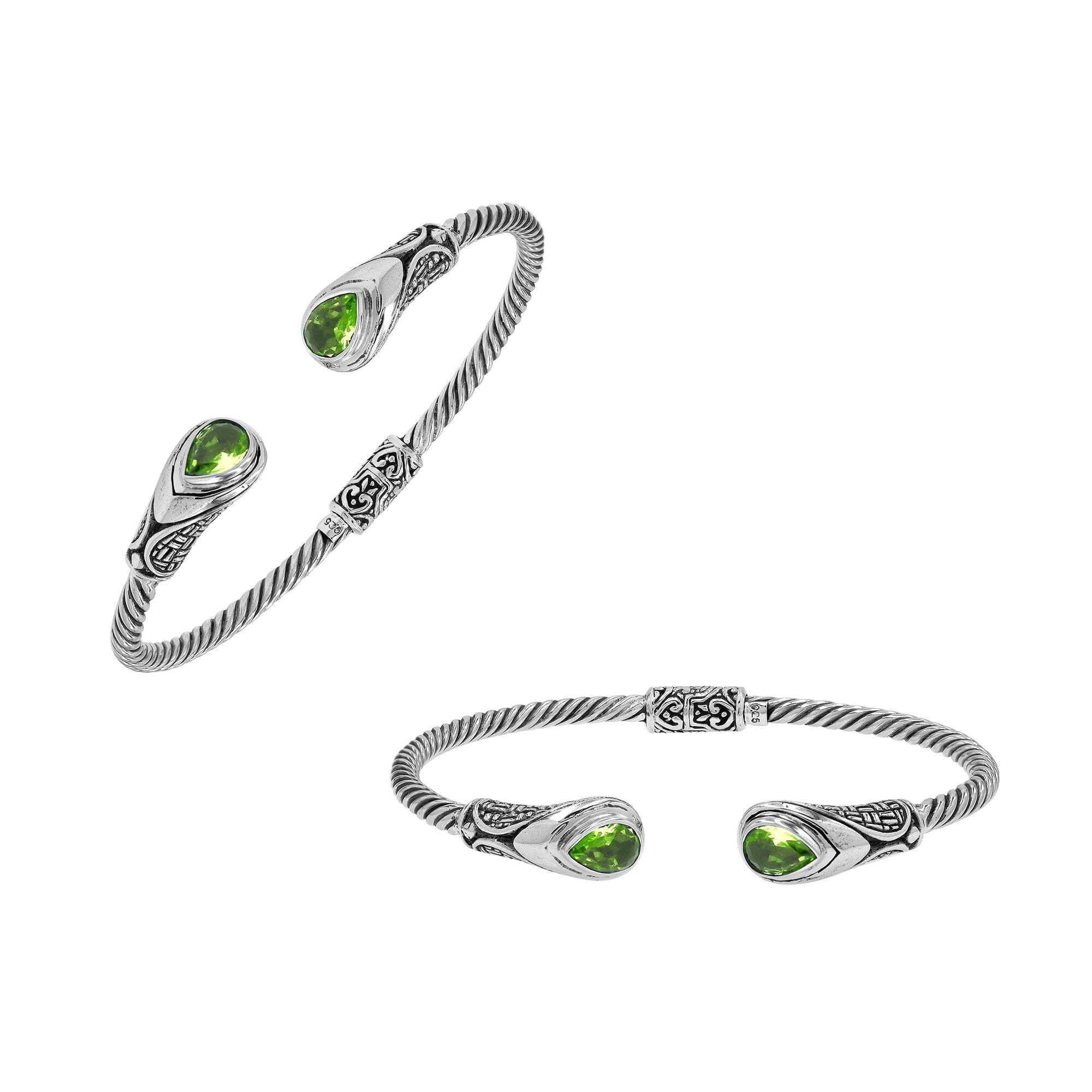 Silver twisted cable bangle in 925 sterling silver with Peridot Quartz ends and Balinese engraving.