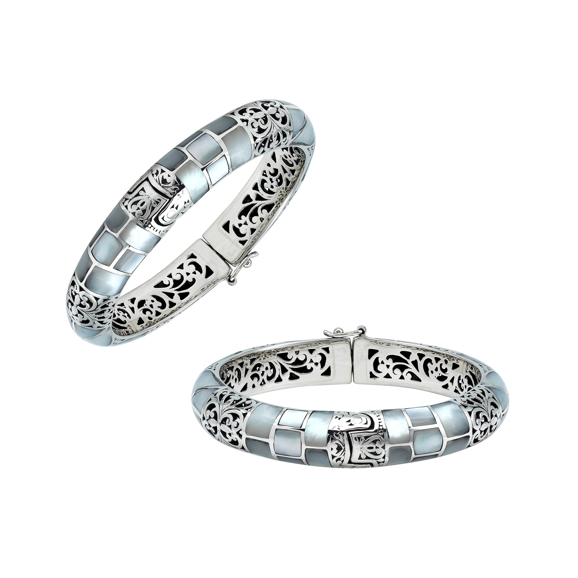 Sterling silver hinged bangle with mother of pearl inlay and intricate filigree design handcrafted in Bali.