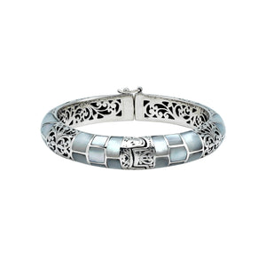 Sterling silver hinged bangle with mother of pearl inlay and intricate filigree design handcrafted in Bali.