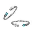 Sterling silver panther head cuff bangle with blue topaz quartz ends and floral carving handcrafted in Bali.