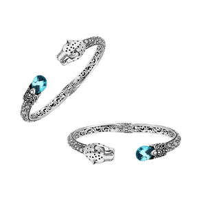 Sterling silver panther head cuff bangle with blue topaz quartz ends and floral carving handcrafted in Bali.