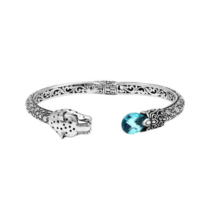 Sterling silver panther head cuff bangle with blue topaz quartz ends and floral carving handcrafted in Bali.