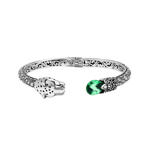 Sterling silver panther head cuff bangle with green quartz ends and floral detailing handcrafted in Bali.