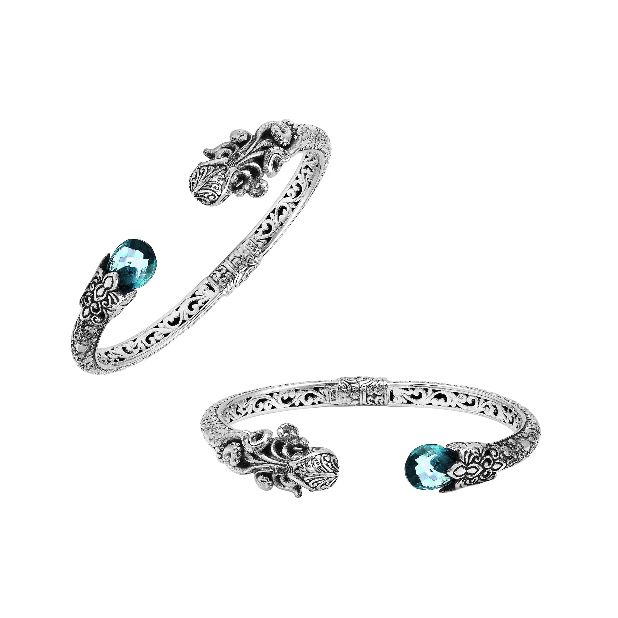 A wholesale sterling silver octopus-themed bangle featuring blue topaz quartz, detailed tentacle carvings, oxidized textures, and a secure hinge lock ideal for bulk jewelry purchases.