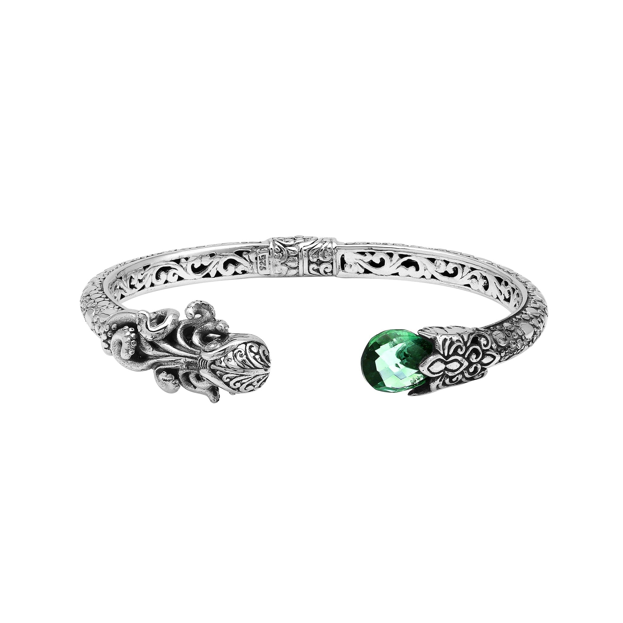 A wholesale sterling silver octopus-themed bangle featuring a bright green quartz stone, ornate Balinese tentacle carvings, oxidized textures, and a secure hinge lock for bulk jewelry orders.