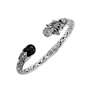 Sterling silver dragon head cuff bangle with black onyx ends and floral carvings handcrafted in Bali.