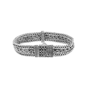 A wholesale sterling silver woven chain bracelet featuring intricate Balinese detailing, oxidized textures, multiple braided strands, and a secure push clasp suitable for bulk jewelry orders.