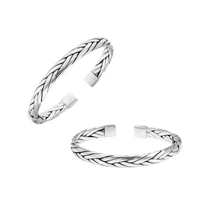 A wholesale sterling silver small woven bangle featuring polished Balinese textures, smooth finishing, and a secure hinge lock perfect for lightweight premium jewelry collections.