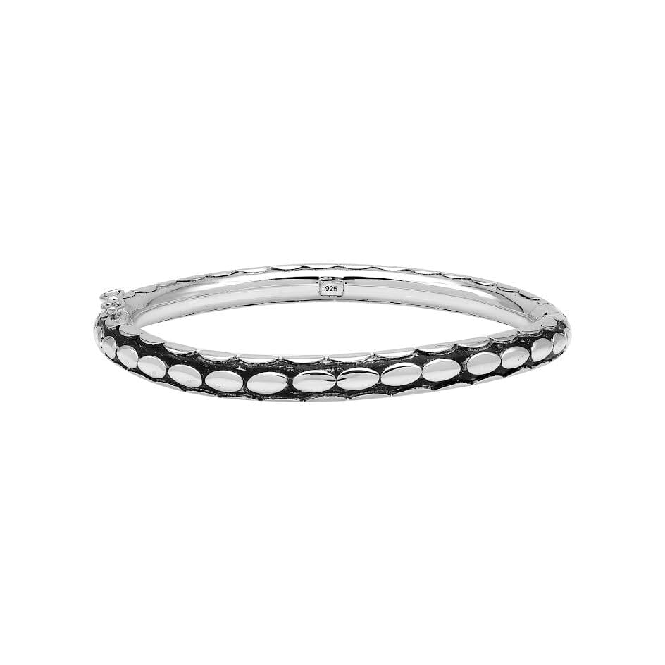 Sterling silver medium-size bangle featuring bold oval textured detailing, polished and oxidized finish, and secure hinge lock with safety latch for wholesale jewelry buyers.