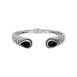 Wholesale sterling silver cuff with black onyx teardrop stones and ornate Balinese carving.