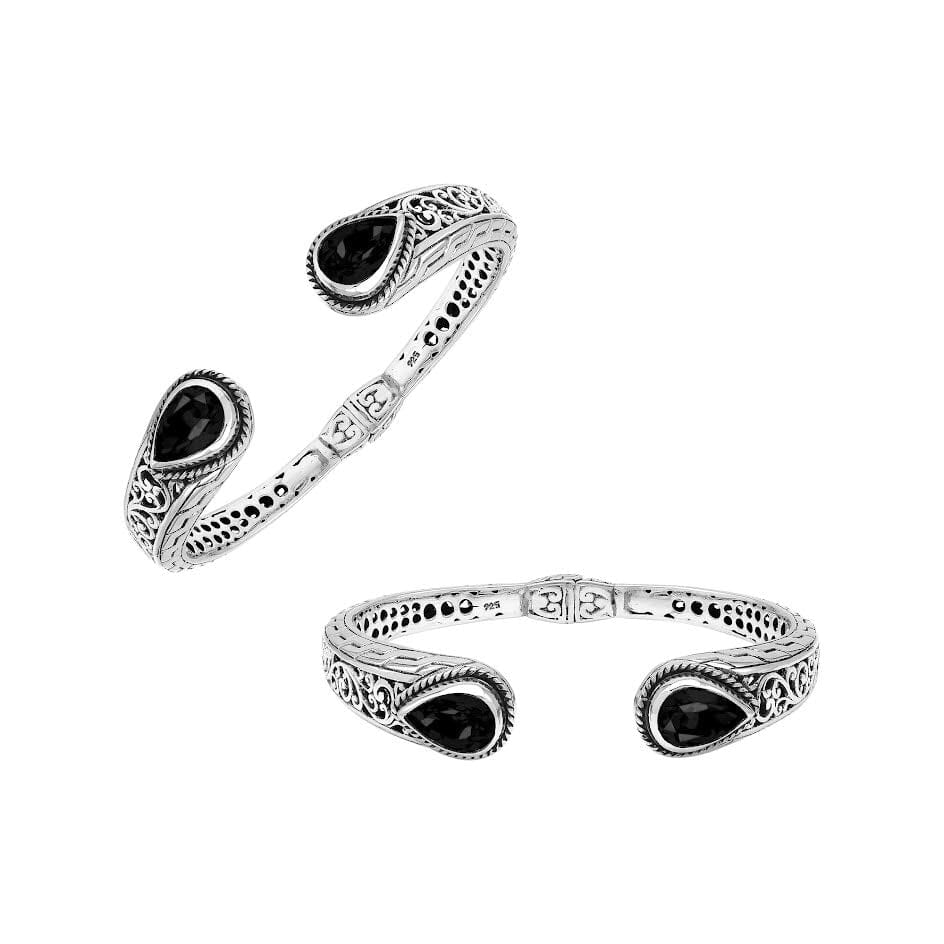 Wholesale sterling silver cuff with black onyx teardrop stones and ornate Balinese carving.