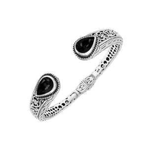 Wholesale sterling silver cuff with black onyx teardrop stones and ornate Balinese carving.