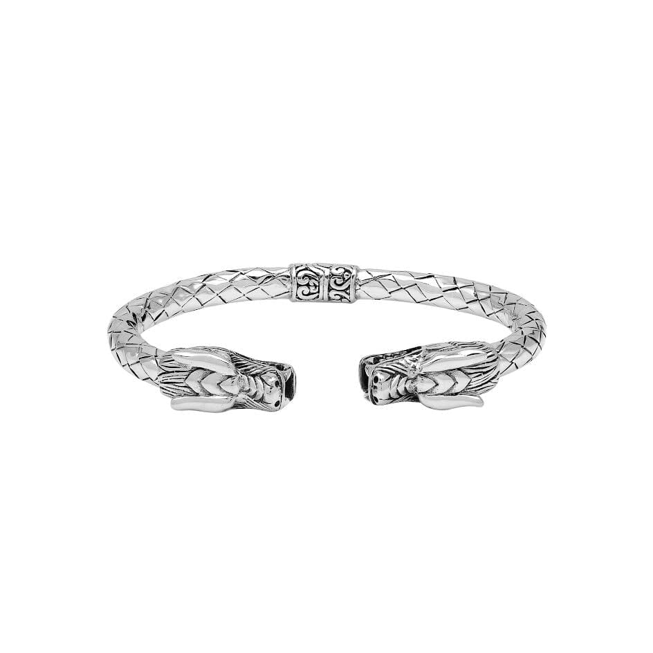 Wholesale sterling silver dragon head cuff bangle featuring detailed carvings, textured patterning, and a secure hinge-lock mechanism designed for reliable and consistent bulk inventory.