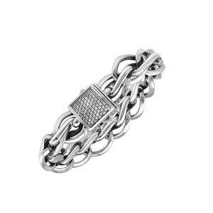 A wholesale sterling silver woven chain bracelet featuring a textured Cubic Zirconia push clasp, mirror-polished heavy links, and durable craftsmanship designed for premium bulk jewelry collections.
