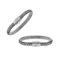 A wholesale sterling silver wide woven bracelet featuring an engraved push clasp, polished and oxidized detailing, and bold textured links crafted for premium bulk jewelry collections.