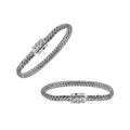 A wholesale sterling silver compact woven bracelet with an etched push clasp, featuring polished and oxidized detailing crafted for high-quality bulk jewelry collections.