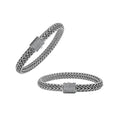 A wholesale sterling silver broad woven bracelet featuring a CVD Diamond-studded push clasp, polished and oxidized detailing, and bold craftsmanship designed for premium bulk jewelry collections.