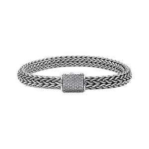 A wholesale sterling silver broad woven bracelet featuring a CVD Diamond-studded push clasp, polished and oxidized detailing, and bold craftsmanship designed for premium bulk jewelry collections.