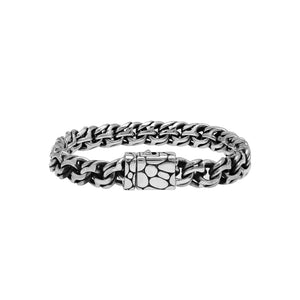 A wholesale sterling silver heavy woven bracelet featuring a textured push clasp, polished and oxidized detailing, and rugged craftsmanship designed for premium bulk jewelry collections.