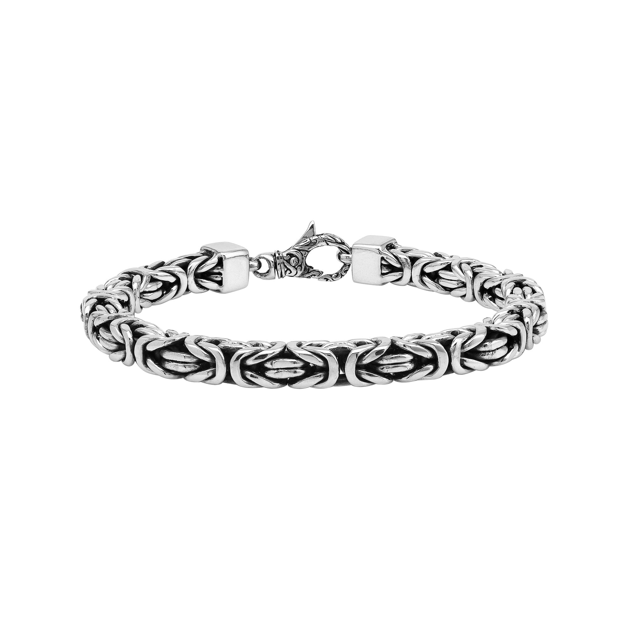 Wholesale sterling silver bracelet featuring a bold 7MM Balinese woven chain with oxidized accents and a secure lobster lock designed for premium bulk catalogs.