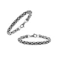 Wholesale sterling silver bracelet featuring a bold 7MM Balinese woven chain with oxidized accents and a secure lobster lock designed for premium bulk catalogs.