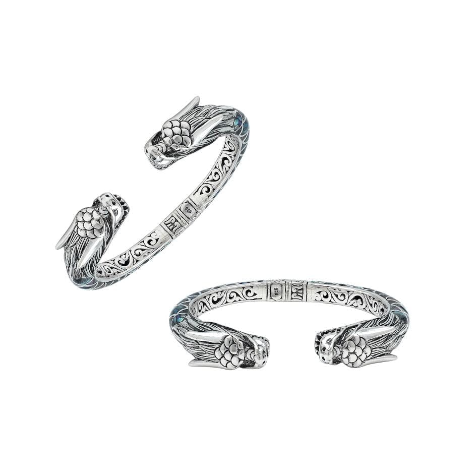 Wholesale sterling silver phoenix cuff bangle featuring Abalone Shell accents, intricate Balinese scroll engraving, and a secure hinge lock for detailed artisan presentation.