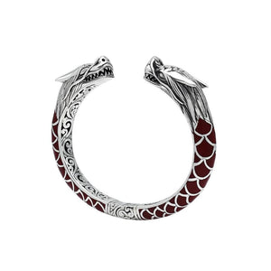 Wholesale sterling silver phoenix-inspired bangle featuring Red Coral accents, ornate Balinese scroll engraving, and a sturdy hinge lock for detailed, artisan-quality wholesale jewelry collections.
