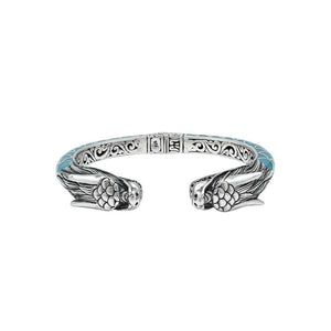 Wholesale sterling silver phoenix bangle featuring Turquoise Shell accents, ornate Balinese scroll engravings, and a secure hinge lock crafted for premium artisan wholesale jewelry collections.