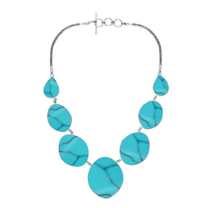 Sterling silver necklace with oval and teardrop turquoise shell links, polished artisan finish.