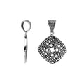 Sterling silver diamond-shaped pendant featuring circular dot engravings, geometric Balinese detailing, and polished oxidized finish.