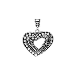 Sterling silver heart-shaped pendant featuring layered open-heart design, dotted Balinese pattern, and oxidized polished finish.
