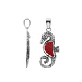 Sterling silver seahorse pendant with Red Coral inlay and detailed Balinese craftsmanship featuring a polished high-gloss finish.