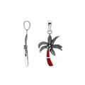 Sterling silver palm tree pendant with red coral inlay and traditional Balinese detailing featuring a polished finish.