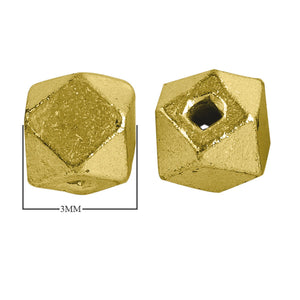 Handcrafted faceted cube bead with 18K gold overlay over copper, made in India for wholesale jewelry production.