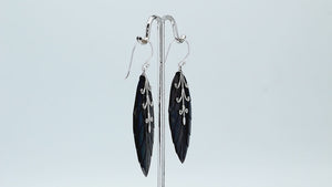 Sterling silver black shell carved leaf drop earrings with polished silver vine detailing and handcrafted dark shell finish.