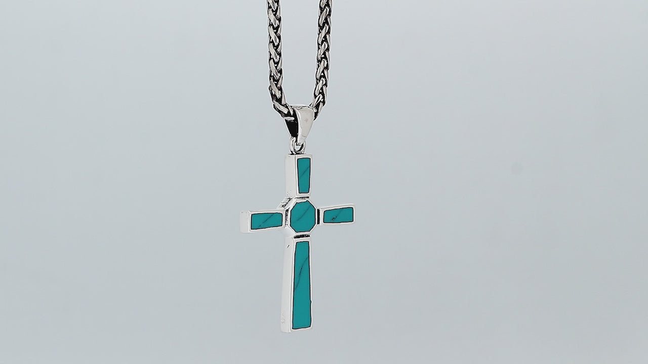 Sterling silver geometric cross pendant with turquoise shell inlay and polished finish