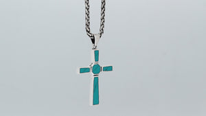 Sterling silver geometric cross pendant with turquoise shell inlay and polished finish