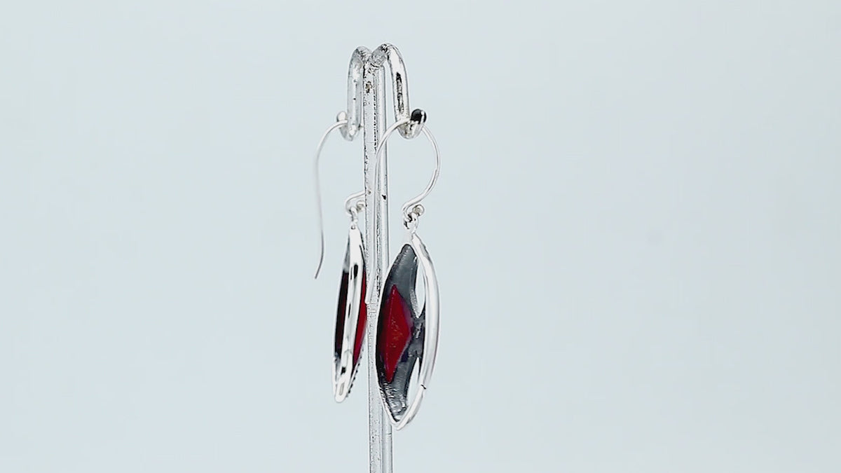 925 Sterling Silver Red Coral marquise drop earrings featuring infinity-inspired double openwork motifs, vibrant red inlays, oxidized dotted silver detailing, polished edges, and classic fishhook ear wires.