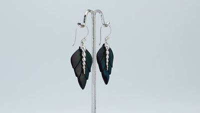 Sterling silver black shell carved leaf drop earrings with polished silver bead detailing and handcrafted dark shell design.