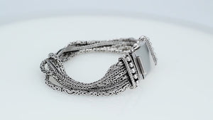 Sterling silver multi-chain panel bracelet with polished finish and handcrafted silver detailing.
