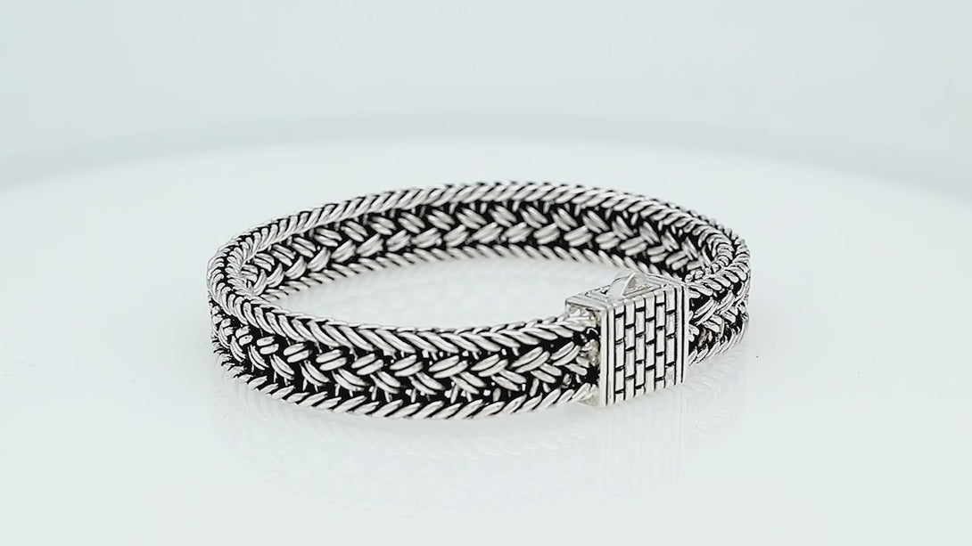 Sterling silver braided chain bracelet with textured clasp handcrafted in Bali.