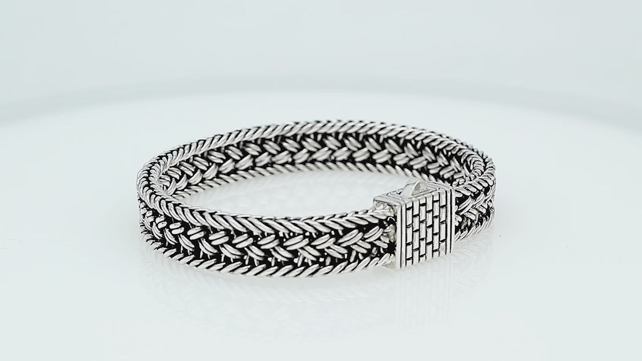 Sterling silver braided chain bracelet with textured clasp handcrafted in Bali.
