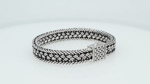 Sterling silver braided chain bracelet with textured clasp handcrafted in Bali.