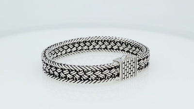 Sterling silver braided chain bracelet with textured clasp handcrafted in Bali.