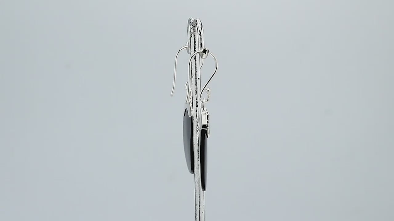 Wholesale sterling silver earrings with Black Shell ovals and an ornate patterned silver cap.