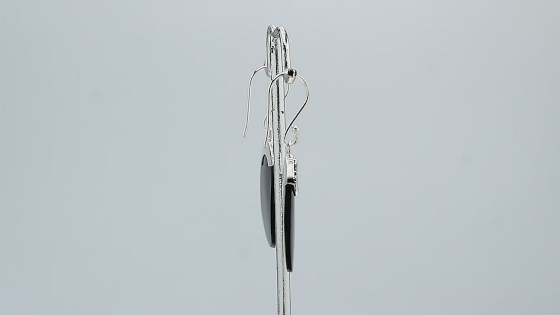 Wholesale sterling silver earrings with Black Shell ovals and an ornate patterned silver cap.