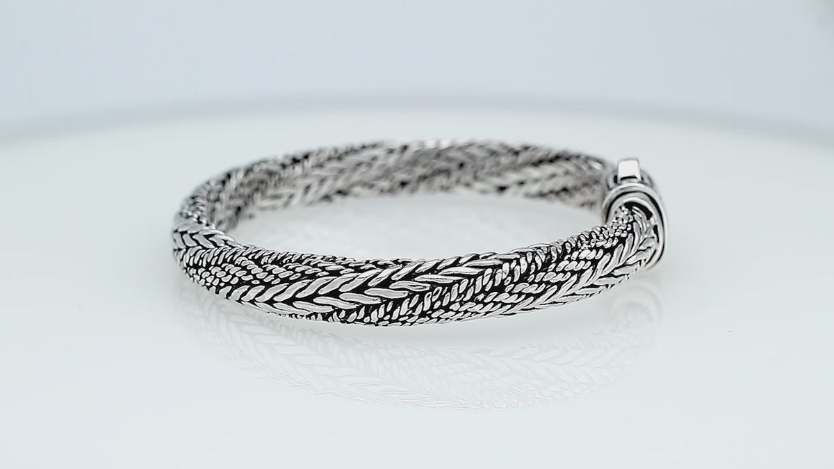 Sterling silver multi-strand braided chain bracelet featuring intricate woven textures, oxidized detailing, polished accents, and an engraved rectangular push clasp.