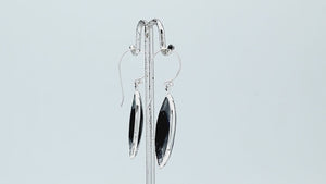 925 Sterling Silver Black Shell marquise drop earrings featuring glossy dark shell inlays, double infinity-inspired openwork motifs, oxidized dotted detailing, polished silver borders, and curved fishhook ear wires.