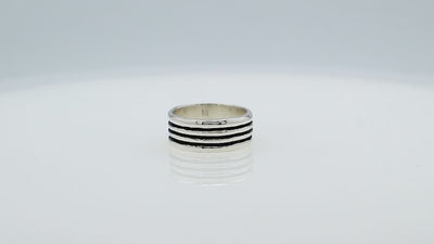 Wholesale sterling silver band ring with three oxidized black stripes, wide unisex design, handcrafted 925 silver jewelry for bulk orders and resellers.