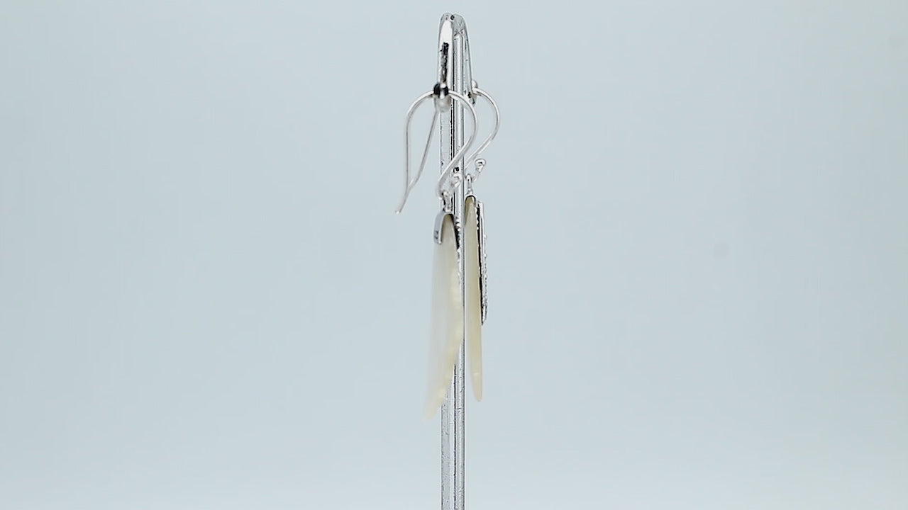 Sterling silver mother of pearl leaf drop earrings with layered shell and polished finish